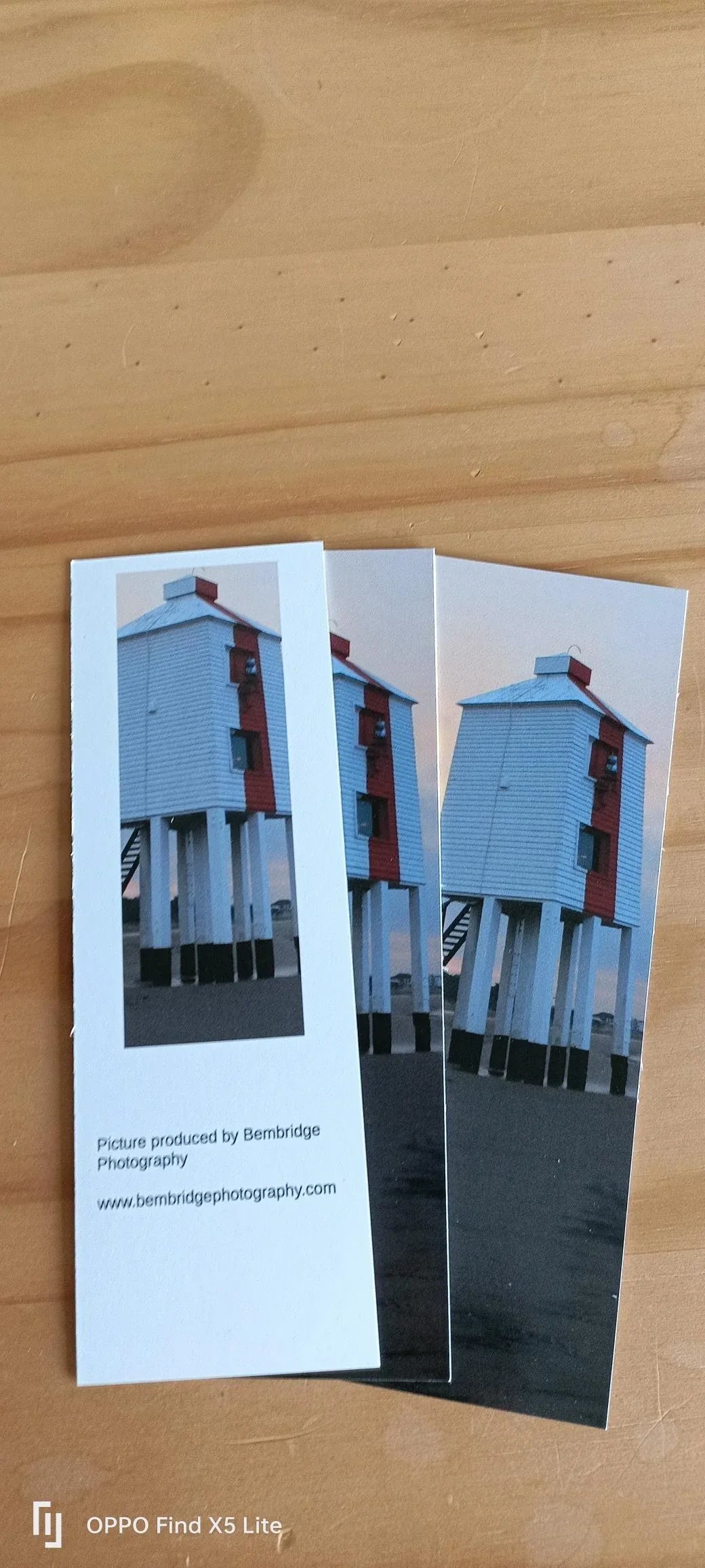 Three Bembridge Photography bookmarks featuring a red and white British beach lighthouse on black sand
