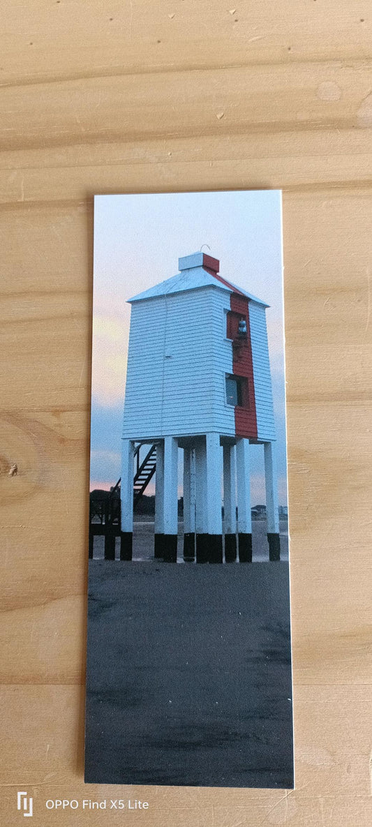 Bembridge beach lighthouse photo print with white and red wooden structure on stilts at sunset