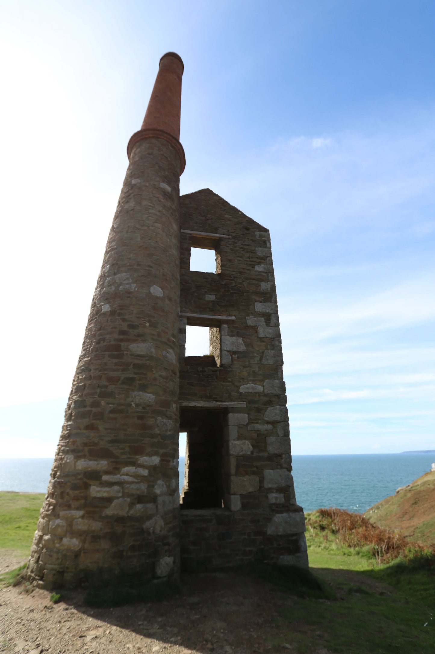 Rinsey Head tin mine engine house ruins overlooking Atlantic Ocean from coastal cliffs Cornwall
