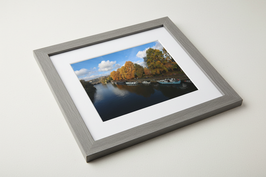 Framed autumn landscape print of Bath Weir with river, moored boats, and golden trees under blue sky